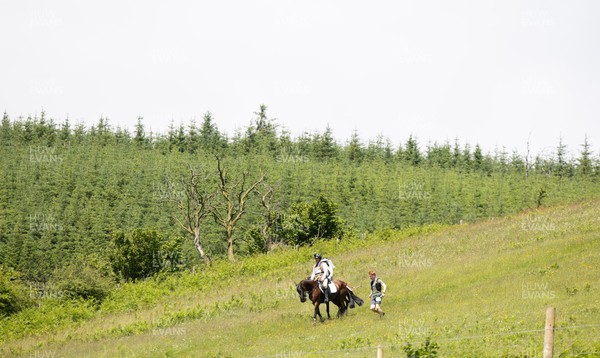 130626 - Man v Horse, Llanwrytd Wells - Competitors make their way around the course during the annual Man v Horse Race held at Llanwrytd Well, Powys, Wales