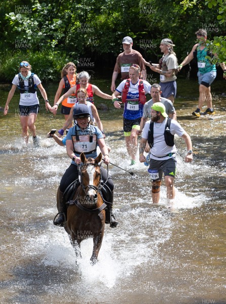 130626 - Man v Horse, Llanwrytd Wells - Competitors make their way around the course during the annual Man v Horse Race held at Llanwrytd Well, Powys, Wales