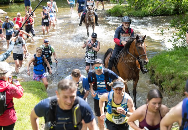 130626 - Man v Horse, Llanwrytd Wells - Competitors make their way around the course during the annual Man v Horse Race held at Llanwrytd Well, Powys, Wales