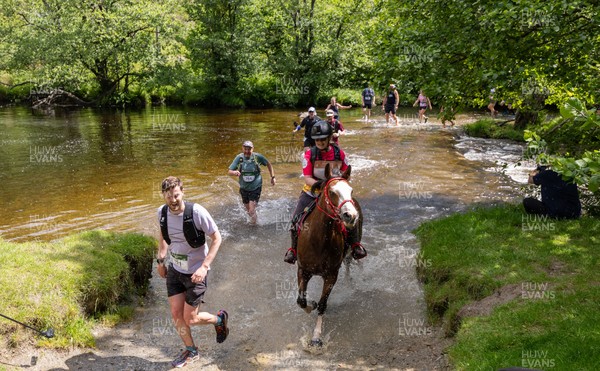 130626 - Man v Horse, Llanwrytd Wells - Competitors make their way around the course during the annual Man v Horse Race held at Llanwrytd Well, Powys, Wales