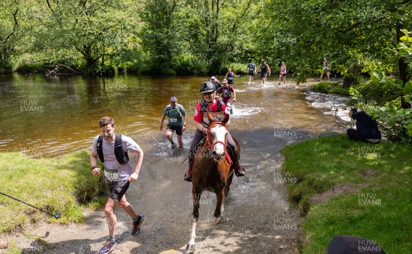130626 - Man v Horse, Llanwrytd Wells - Competitors make their way around the course during the annual Man v Horse Race held at Llanwrytd Well, Powys, Wales