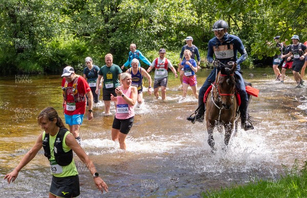 130626 - Man v Horse, Llanwrytd Wells - Competitors make their way around the course during the annual Man v Horse Race held at Llanwrytd Well, Powys, Wales