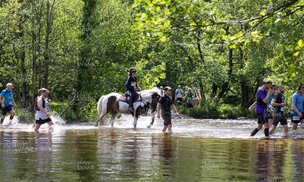 130626 - Man v Horse, Llanwrytd Wells - Competitors make their way around the course during the annual Man v Horse Race held at Llanwrytd Well, Powys, Wales
