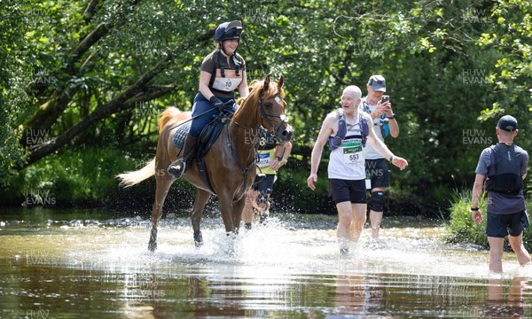 130626 - Man v Horse, Llanwrytd Wells - Competitors make their way around the course during the annual Man v Horse Race held at Llanwrytd Well, Powys, Wales