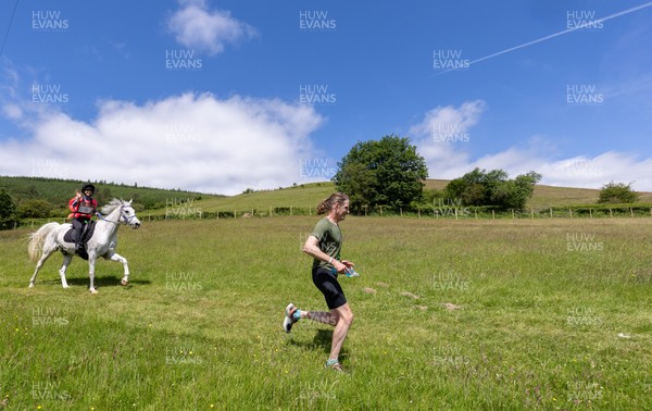 130626 - Man v Horse, Llanwrytd Wells - Competitors make their way around the course during the annual Man v Horse Race held at Llanwrytd Well, Powys, Wales