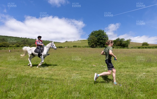 130626 - Man v Horse, Llanwrytd Wells - Competitors make their way around the course during the annual Man v Horse Race held at Llanwrytd Well, Powys, Wales