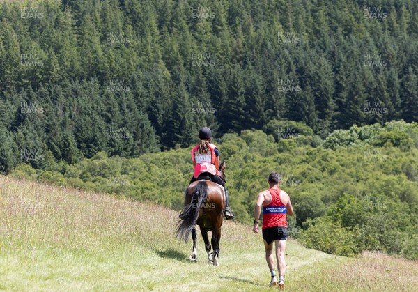 130626 - Man v Horse, Llanwrytd Wells - Competitors make their way around the course during the annual Man v Horse Race held at Llanwrytd Well, Powys, Wales
