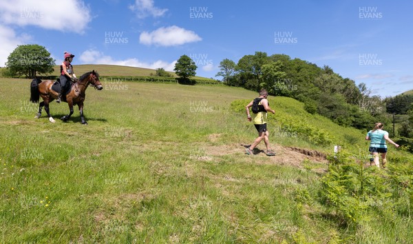 130626 - Man v Horse, Llanwrytd Wells - Competitors make their way around the course during the annual Man v Horse Race held at Llanwrytd Well, Powys, Wales