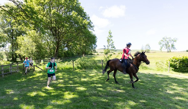 130626 - Man v Horse, Llanwrytd Wells - Competitors make their way around the course during the annual Man v Horse Race held at Llanwrytd Well, Powys, Wales