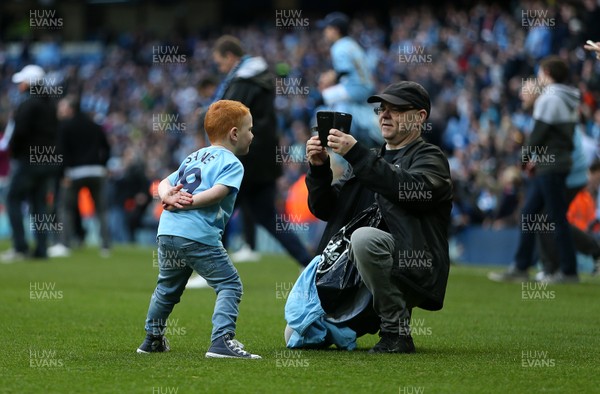 220418 - Manchester City v Swansea - Premier League - Supporters invade the pitch at full time to celebrate