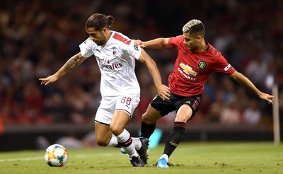 030819 - Manchester United v AC Milan - International Champions Cup - Ricardo Rodriguez of AC Milan is tackled by Andreas Pereira of Manchester United