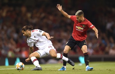 030819 - Manchester United v AC Milan - International Champions Cup - Ricardo Rodriguez of AC Milan is tackled by Andreas Pereira of Manchester United