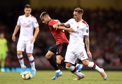 030819 - Manchester United v AC Milan - International Champions Cup - Andreas Pereira of Manchester United is tackled by Lucas Biglia of AC Milan