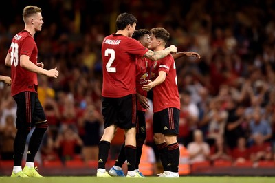 030819 - Manchester United v AC Milan - International Champions Cup - Daniel James of Manchester United scores the winning penalty