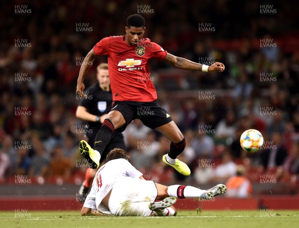 030819 - Manchester United v AC Milan - International Champions Cup - Marcus Rashford of Manchester United is tackled by Fabio Borini of AC Milan