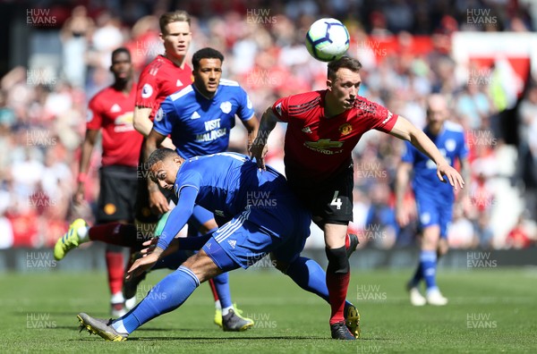 120519 - Manchester United v Cardiff City - Premier League - Phil Jones of Manchester United is challenged by Kenneth Zohore of Cardiff City