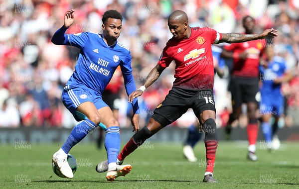 120519 - Manchester United v Cardiff City - Premier League - Josh Murphy of Cardiff City is challenged by Ashley Young of Manchester United