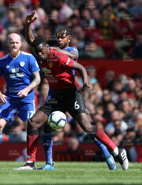 120519 - Manchester United v Cardiff City - Premier League - Paul Pogba of Manchester United is challenged by Leandro Bacuna of Cardiff City