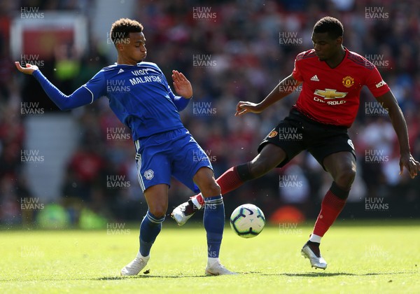 120519 - Manchester United v Cardiff City - Premier League - Josh Murphy of Cardiff City is challenged by Paul Pogba of Manchester United