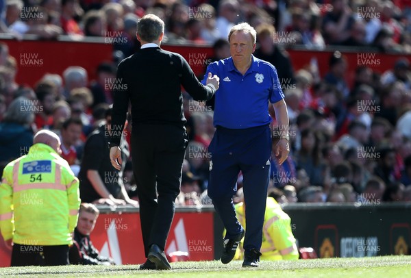 120519 - Manchester United v Cardiff City - Premier League - Manchester United Manager Ole Gunnar Solskjaer and Cardiff City Manager Neil Warnock shake hands at full time