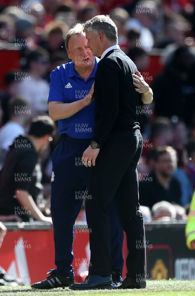 120519 - Manchester United v Cardiff City - Premier League - Cardiff City Manager Neil Warnock consoles Manchester United Manager Ole Gunnar Solskjaer at full time