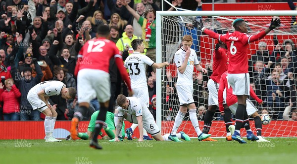 310318 - Manchester United v Swansea City - Premier League -  Romelu Lukaku (9, behind 6) of Manchester United celebrates scoring the first goal of the match
