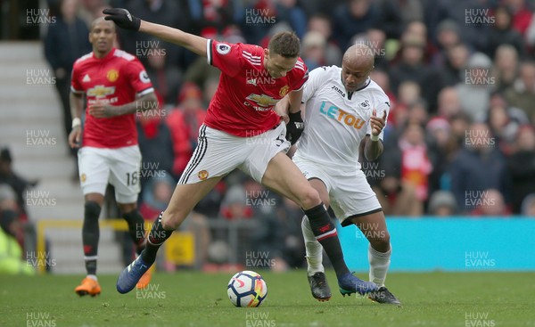 310318 - Manchester United v Swansea City - Premier League -  Nemanja Matic of Manchester United and Andre Ayew of Swansea