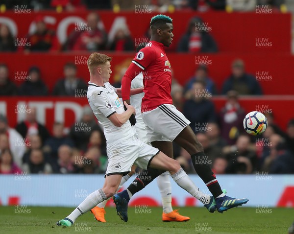 310318 - Manchester United v Swansea City - Premier League -  Sam Clucas of Swansea and Paul Pogba of Manchester United