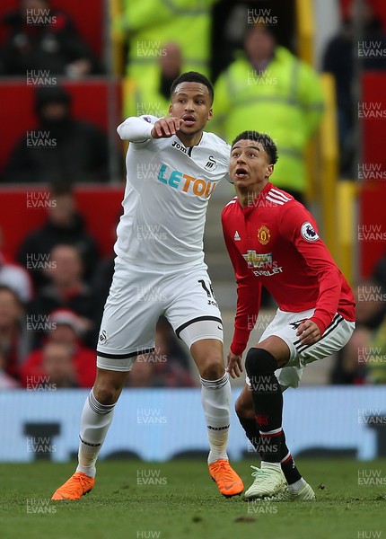 310318 - Manchester United v Swansea City - Premier League -  Martin Olsson of Swansea and Jesse Lingard of Manchester United
