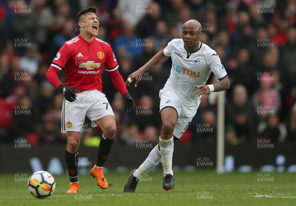 310318 - Manchester United v Swansea City - Premier League -  Andre Ayew of Swansea touches Alexis Sanchez on Manchester United in the chest