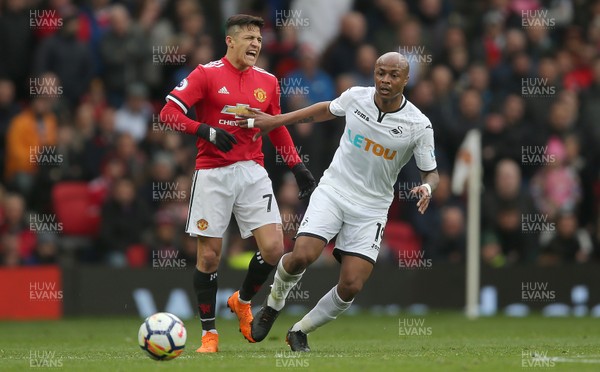 310318 - Manchester United v Swansea City - Premier League -  Andre Ayew of Swansea touches Alexis Sanchez on Manchester United in the chest