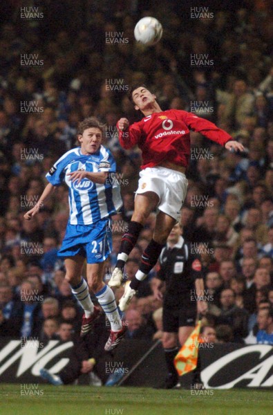 260206 - Manchester United v Wigan Athletic - Carling Cup Final - Man Utd's Cristiano Ronaldo and  Jimmy Bullard reach for high ball