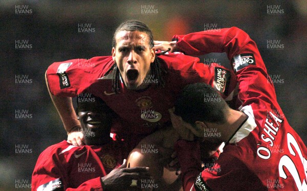 260206 - Manchester United v Wigan Athletic - Carling Cup Final - Man Utd's Rio Ferdinand celebrates Cristiano Ronaldo's goal 