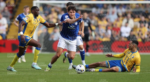 020526 - Mansfield Town v Cardiff City - Sky Bet League 1 - Rubin Colwill of Cardiff is challenged by Deji Oshilaja of Mansfield and Lucas Atkins of Mansfield