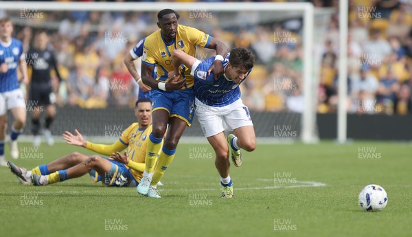 020526 - Mansfield Town v Cardiff City - Sky Bet League 1 - Rubin Colwill of Cardiff is caught by Lucas Atkins of Mansfield