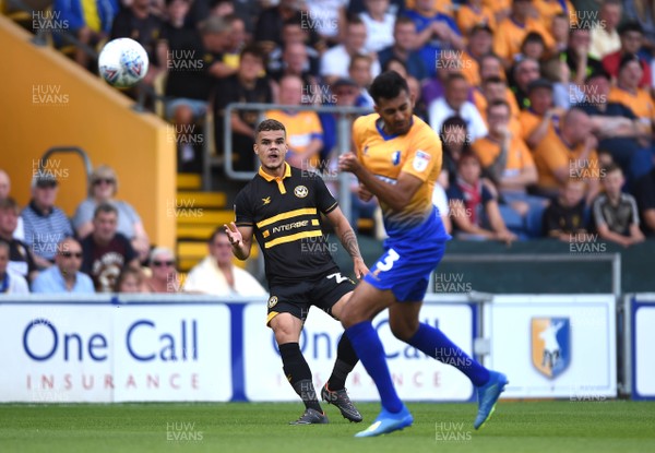 040818 - Mansfield Town v Newport County - League 2 - Tyler Hornby-Forbes of Newport County gets the ball past Malvind Benning of Mansfield Town