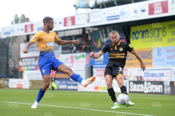 040818 - Mansfield Town v Newport County - League 2 - Dan Butler of Newport County tries to get the ball past CJ Hamilton of Mansfield Town