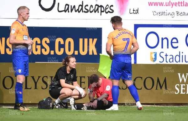040818 - Mansfield Town v Newport County - League 2 - Assistant Referee is treated before being stretchered off