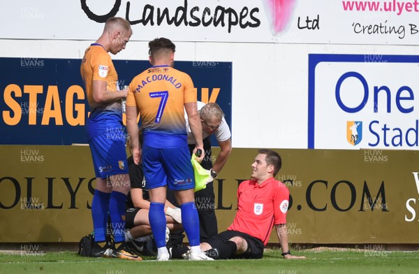 040818 - Mansfield Town v Newport County - League 2 - Assistant Referee is treated before being stretchered off