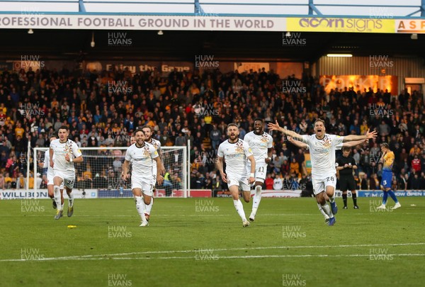 120519 - Mansfield Town v Newport County, Sky Bet League 2 Play Off Semi Final, second leg - Newport County players celebrate winning the penalty shoot out and heading to Wembley for the League 2 Play Off Final