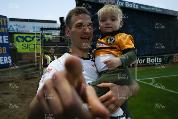 120519 - Mansfield Town v Newport County, Sky Bet League 2 Play Off Semi Final, second leg - Mickey Demetriou of Newport County celebrate with his son after winning the penalty shoot out and heading to Wembley for the League 2 Play Off Final