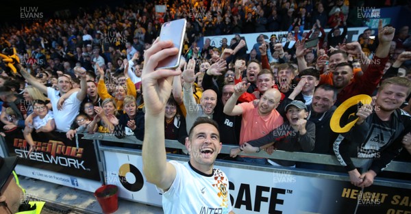 120519 - Mansfield Town v Newport County, Sky Bet League 2 Play Off Semi Final, second leg - Matty Dolan of Newport County celebrates with the fans after winning the penalty shoot out and heading to Wembley for the League 2 Play Off Final