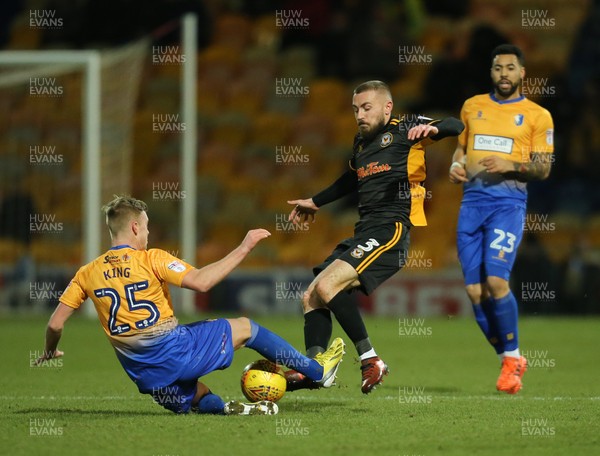 130218 - Mansfield Town v Newport County, Sky Bet League 2 - Dan Butler of Newport County is challenged by Adam King of Mansfield Town