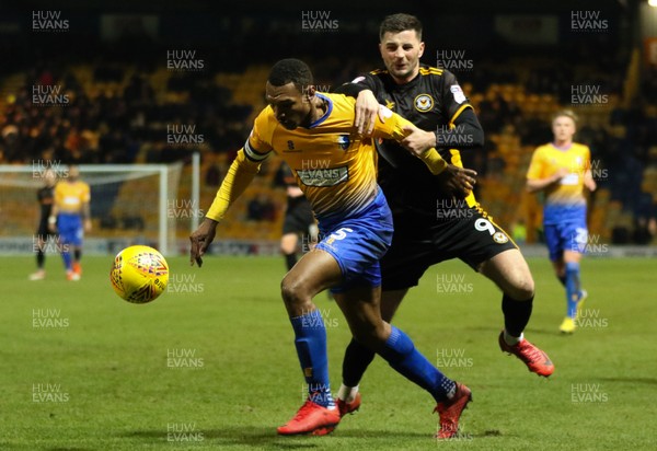 130218 - Mansfield Town v Newport County, Sky Bet League 2 - Krystian Pearce of Mansfield Town and Padraig Amond of Newport County compete for the ball