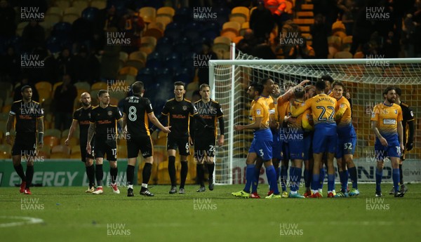 130218 - Mansfield Town v Newport County, Sky Bet League 2 - Newport County players question each other as Mansfield players celebrate the fourth goal