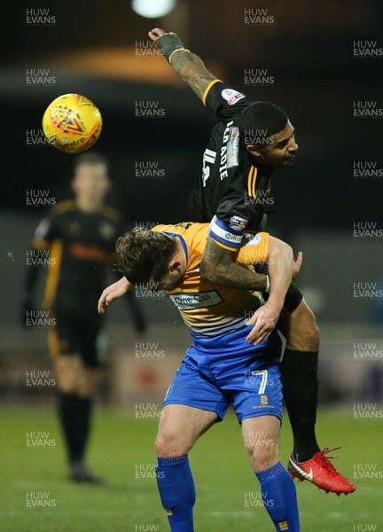 130218 - Mansfield Town v Newport County, Sky Bet League 2 - Joss Labadie of Newport County tangles with Alex MacDonald of Mansfield Town as he looks to win the ball