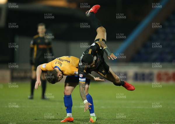 130218 - Mansfield Town v Newport County, Sky Bet League 2 - Joss Labadie of Newport County tangles with Alex MacDonald of Mansfield Town as he looks to win the ball