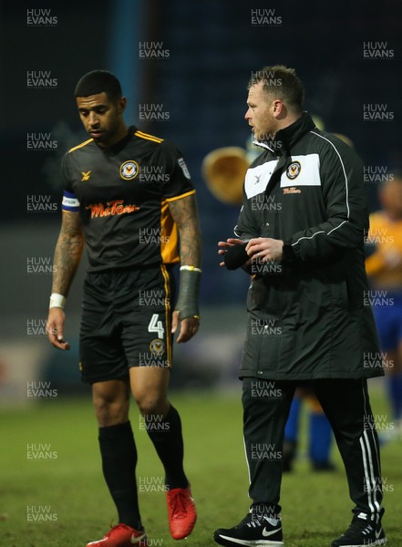 130218 - Mansfield Town v Newport County, Sky Bet League 2 - Newport County manager Michael Flynn and Joss Labadie of Newport County leave the pitch at the end of the match