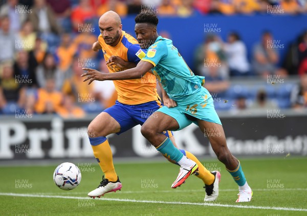 140821 - Mansfield Town v Newport County - EFL SkyBet League 2 - Timmy Abraham of Newport County is tackled by Farrend Rawson of Mansfield Town
