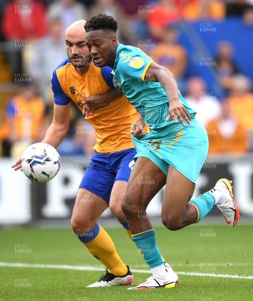 140821 - Mansfield Town v Newport County - EFL SkyBet League 2 - Timmy Abraham of Newport County is tackled by Farrend Rawson of Mansfield Town